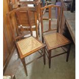 A pair of Edwardian stained wood framed bedroom chairs with rattan seat panels