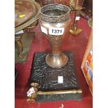 A cast iron teapot stand, a hammered and coppered vase, and a brass gavel