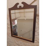 A 77cm wide reproduction walnut and parcel gilt framed bevelled oblong wall mirror with stylised