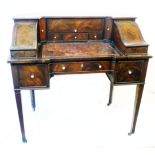 A 98cm late Georgian mahogany writing table with compartments and drawers to top, pull out writing