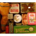 A box containing assorted old advertising tins