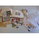 A collection of mainly 20th Century world stamps loose, in named envelopes and on sheets, some