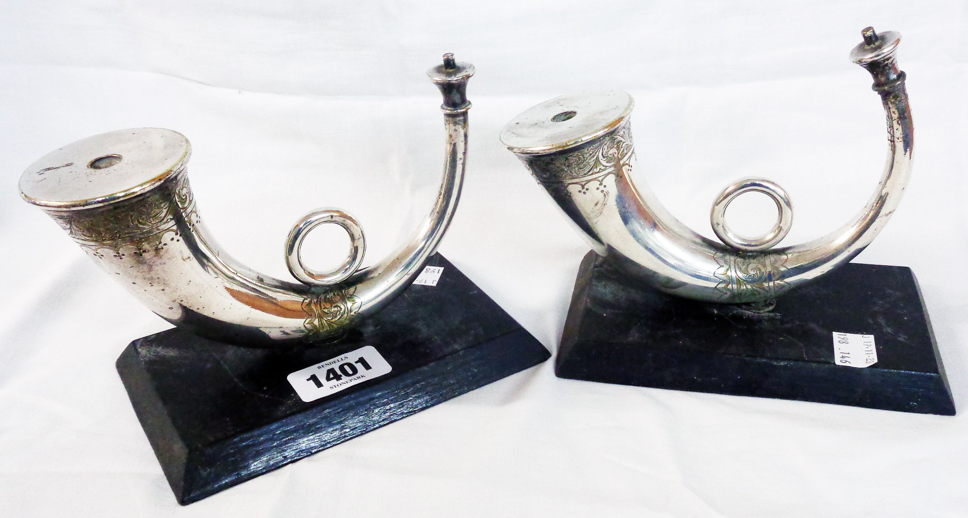 A pair of vintage silver plated horn pattern wick table lamps set on wooden plinth bases