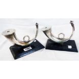 A pair of vintage silver plated horn pattern wick table lamps set on wooden plinth bases