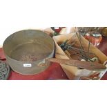 A large copper sauce pan with iron handle