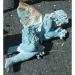 An iron garden reclining fairy with painted finish