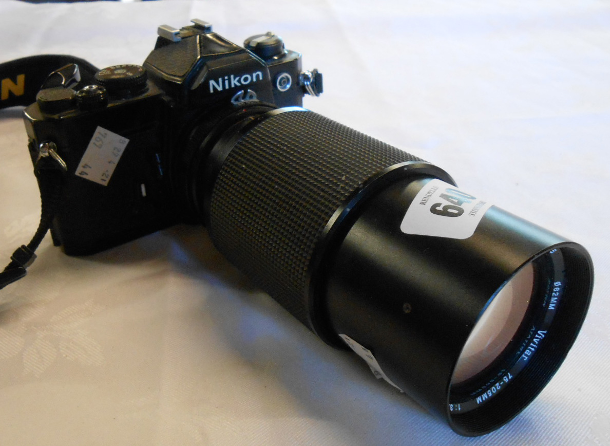 A vintage Nikon FM camera with Vivitar 75-205mm lens