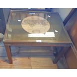 A 54cm hardwood and brass bound coffee table with reproduction map print under glass to top