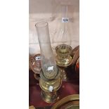 Two brass table oil lamps with chimneys