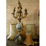 An ornate porcelain and brassed spelter five branch candelabra form table lamp