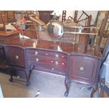 A 1.98m early 19th Century mahogany serpentine break front sideboard with decorative brass gallery