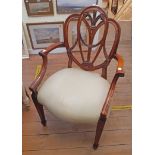 A reproduction mahogany framed elbow chair with decorative pierced splat and Prince of Wales