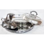 A silver plated entree dish with detachable handle, gallery tray and ornate chamber candlestick