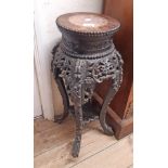 A 66cm antique Chinese ebonised rosewood jardinière stand with brown marble inset top and ornate