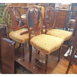 A set of six reproduction mahogany framed Hepplewhite style dining chairs with decorative pierced