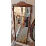 A 35cm wide vintage stained wood framed narrow oblong wall mirror