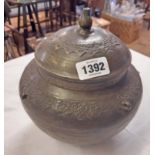 An oriental bronze pot and lid