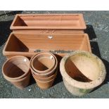 Two rectangular terracotta pots and seven small round pots