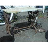 A wrought iron garden table with marble top - sold with a 19th Century bootscraper - a/f