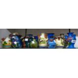 Thirteen Torquay pottery tulip or udder vases including Longpark and Daison, etc. - various