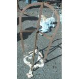 An old wrought iron saddle rack