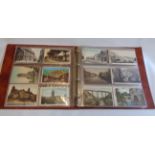 A brown ring bound album containing a collection of sleeve mounted early 20th Century postcards,