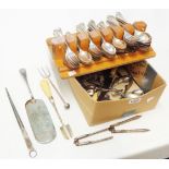 A box containing a wooden rack of assorted silver plated cutlery and other loose items, including