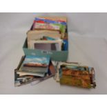 A box containing a collection of 20th Century postcards, numerous posted envelopes, Kodak filters,