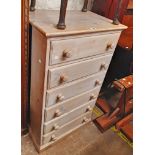 A 64cm 20th Century pine chest of six long drawers with limed effect finish
