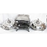 A pair of ornate silver plated entree dishes with detachable handles - sold with a pair of bain