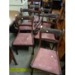 A set of six mahogany framed sabre leg dining chairs with remains of brass stringing and drop-in