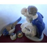 A Royal Copenhagen figure group of a couple kissing - sold with a B&G bird and two Royal