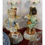 A pair of Sitzendorf porcelain figural candlesticks - a/f
