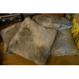 A set of four John Lewis duck feather faux fur covered cushions