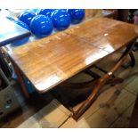 A 92cm (overall) 19th Century mahogany campaign style folding coaching table with moulded top and