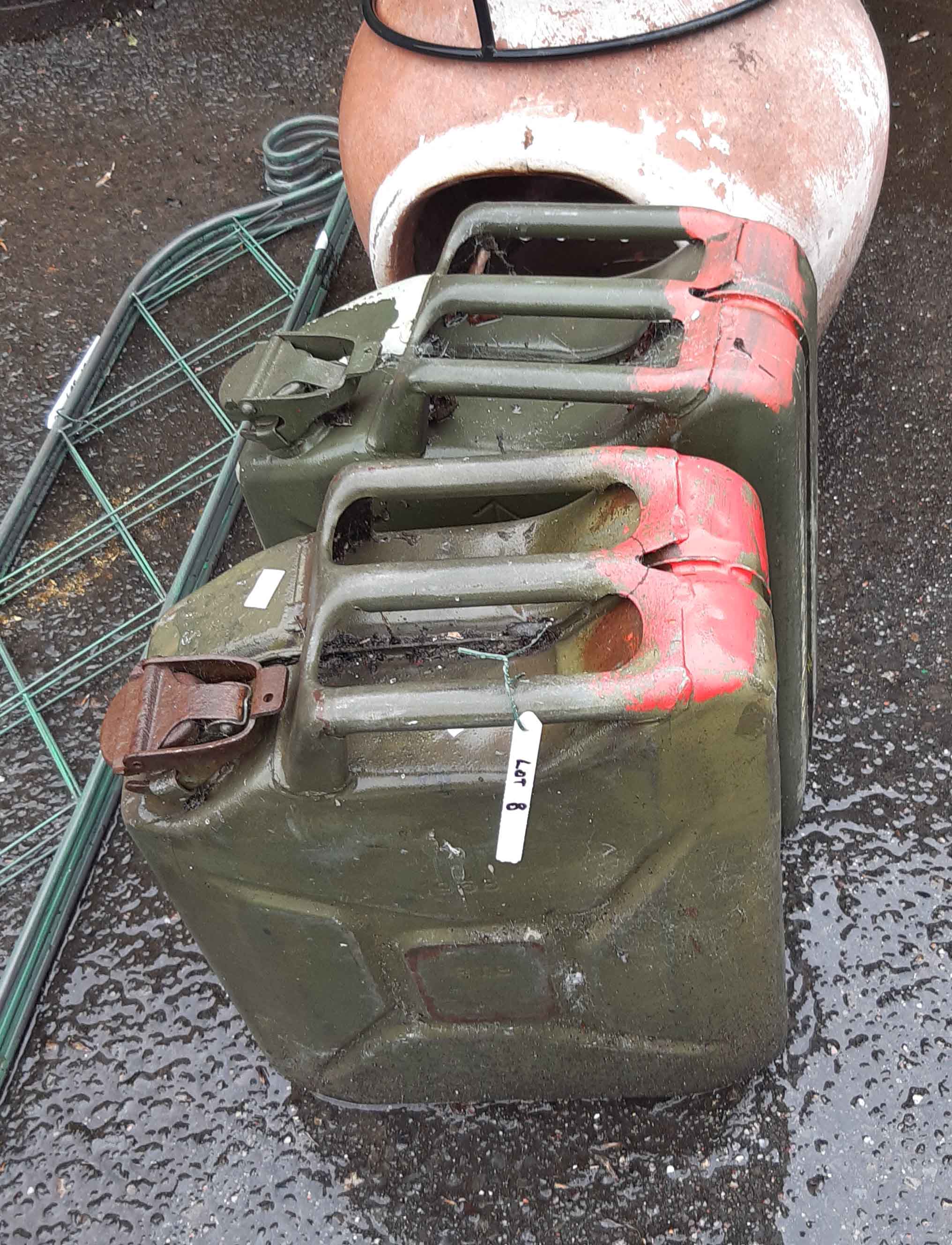 Two large green painted metal jerry cans - late 20th Century