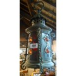 A copper hanging lantern with coloured and bull's-eye leaded glass panels
