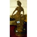 An old cast iron figure of a lady