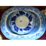 A Willow pattern meat plate, a Bovey Pottery meat plate, and a small flow blue dish