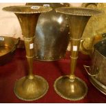 A pair of brass trumpet vases with remains of silver plated finish