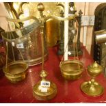 A set of brass balance scales and a gimbal oil lamp