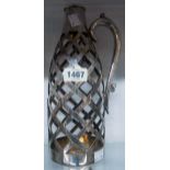 A silver plated lattice pattern hinged bottle carrier bearing Rd. No. 9125245