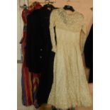 A quantity of vintage clothing including blazer bearing RNBA 1939-45 badge, a wedding dress and