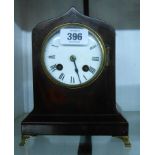 A small 19th Century mahogany cased desk clock with eight day bell striking movement - minor