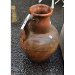 A large terracotta jug