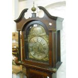 A late 18th Century quarter sawn oak longcase clock, the 29cm brass and silvered arched dial