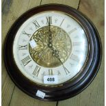 A polished wood cased Seiko battery wall clock playing numerous festive tunes and others