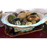 A 19th Century bone china tureen base containing assorted lacquer, papier-mâché and other eggs -