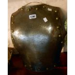 An antique cavalry trooper's steel backplate