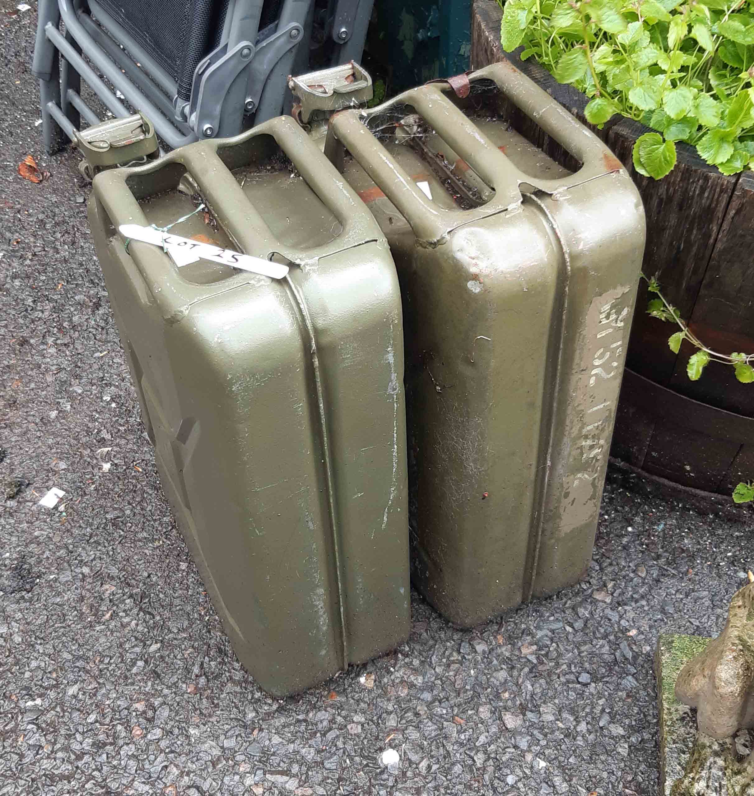 Two large green painted metal jerry cans - late 20th Century